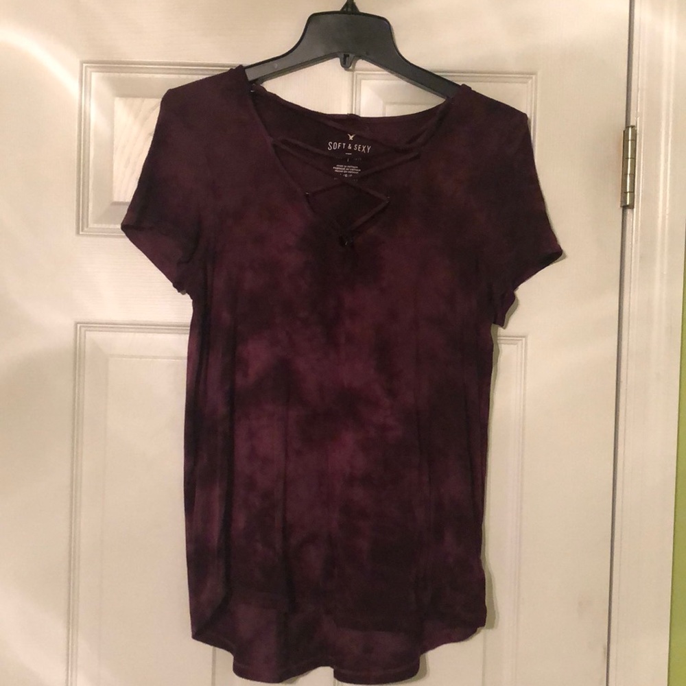 Maroon top with strings in the front.